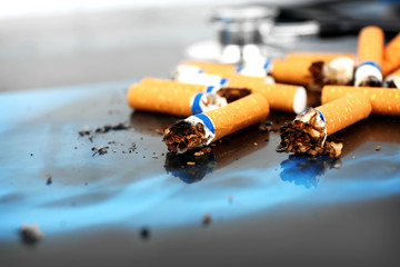 Cigarettes and stethoscope on x-ray lung, close up