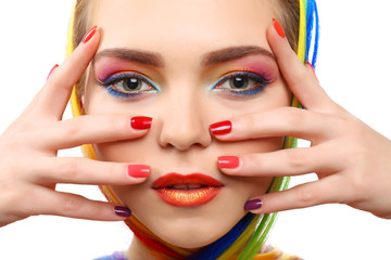 Beautiful girl with colorful makeup, manicure and hairstyle on white background