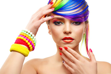 Naklejka premium Beautiful girl with colorful makeup, manicure and hairstyle on white background