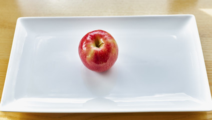 Red Apple on White Plate