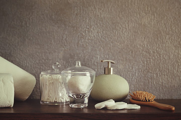 Bath accessories on grey wall background