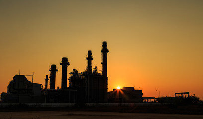 Fototapeta na wymiar Gas turbine electrical power plant with sunset