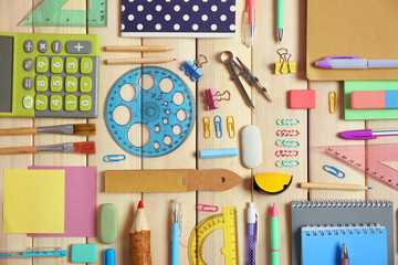 Flat lay of stationery on wooden background
