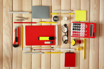 Flat lay of stationery on wooden background