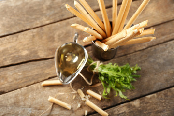 Bread sticks with arugula and oil, closeup