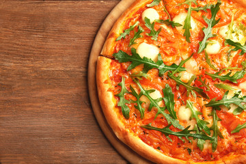 Margherita pizza with arugula on  background