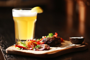 Fresh meat with garnish on a wooden board