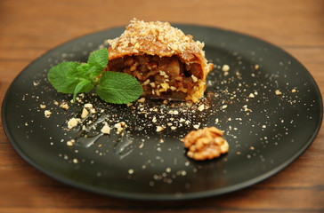 Piece of apple roll on a plate