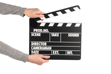 Fototapeta premium Female hands holding movie clapper isolated on white