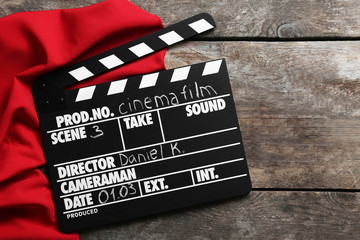 Movie clapper on wooden background