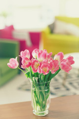 Fresh bouquet of tulips on a coffee table