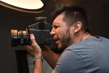 Fototapeta premium photographer with a medium format camera in the studio