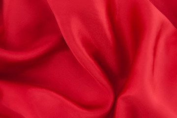 Red satin background. Photo texture. Top view