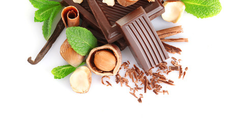 Chocolate with mint and hazelnuts on white background