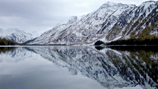 Lower Multinskoe lake in the Altai Mountains in cloudy weather.