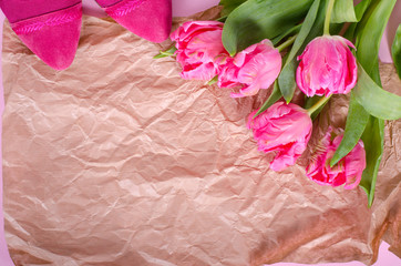 Beautiful pink tulips in paper on vintage paper. Free space for your text.