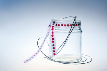 decorated clean glass jar againt light background