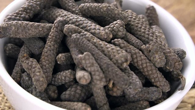Portion of rotating Long Pepper as not loopable 4KUHD footage