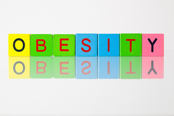 Obesity - an inscription from children's  blocks