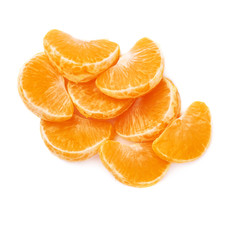 Pile of slice sections of tangerine isolated over the white background