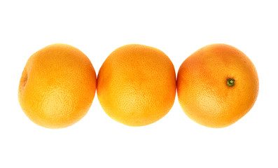 Three fresh juicy grapefruits composition isolated over the white background