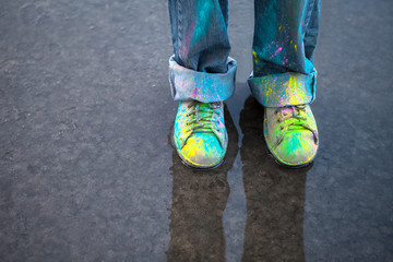 Colorful shoes on puddle