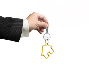 Man hand holding key with house shape keyring