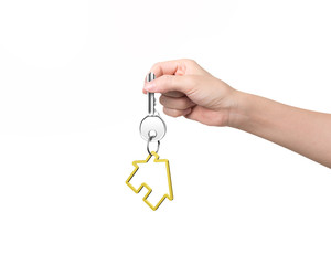 Woman hand holding key with house shape keyring