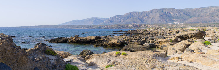Fototapeta na wymiar Stony beach on Crete island, Greece