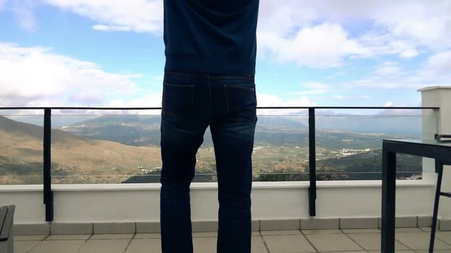 Young Man Walking Out On Terrace And Stretching His Arms On Terrace, Super Slow Motion 
