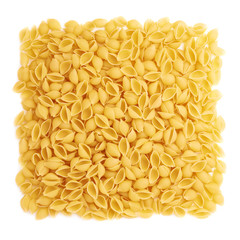 Pile of dry conchiglie pasta over isolated white background