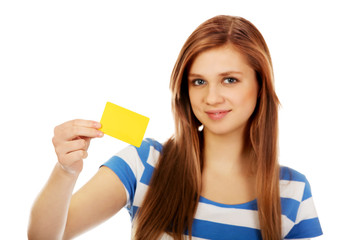 Teenage woman holding empty business card