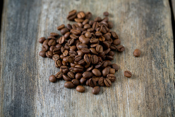 coffee beans on wooden surface