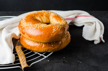 Bagels with sesam on dark background