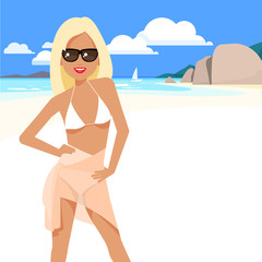 Cute girl in a bikini and pareo on the beach.