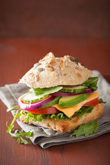 tomato avocado cheese sandwich with cucumber onion