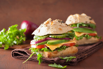 tomato avocado cheese sandwich with cucumber onion