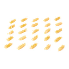 Single pieces of dry rotini pasta over isolated white background