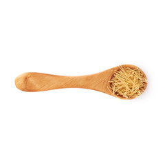 Wooden spoon filled with dry noodles pasta over isolated white background