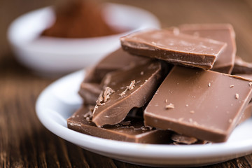 Milk Chocolate on wooden background