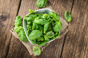 Portion of fresh Basil (close-up shot)