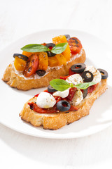 italian appetizer - bruschetta on plate, vertical