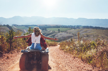 Couple having fun on a quad bike in countryside © Jacob Lund