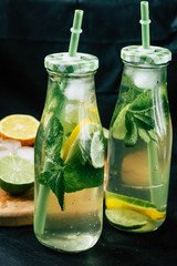 
Mojito cocktail in a bur on a rustic table, selective focus