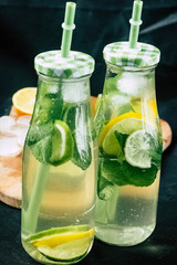 
Mojito cocktail in a bur on a rustic table, selective focus