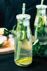 
Mojito cocktail in a bur on a rustic table, selective focus