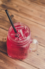 Strawberry italian soda on wood table