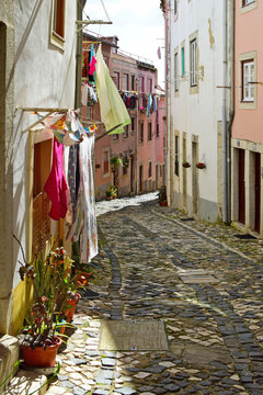 A narrow street in Alfama district in Lisbon, Portugal