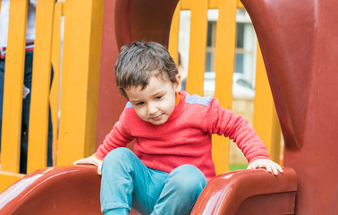 Fototapeta na wymiar boy playing on the Playground