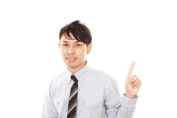 指示する笑顔のビジネスマン